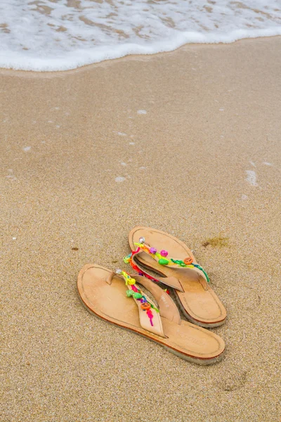 Summer flip flops on the beach Stock Picture