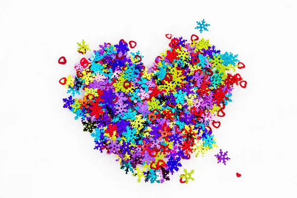 Color the heart of decorative snowflakes and hearts in the snow — Stock Photo, Image