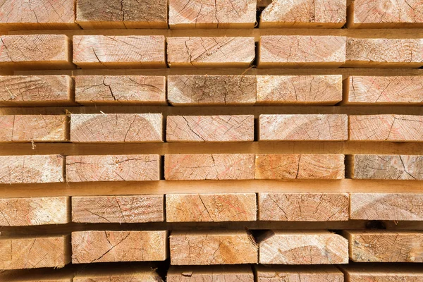 Wooden planks to build a house on a stack of folded construction — Stock Photo, Image