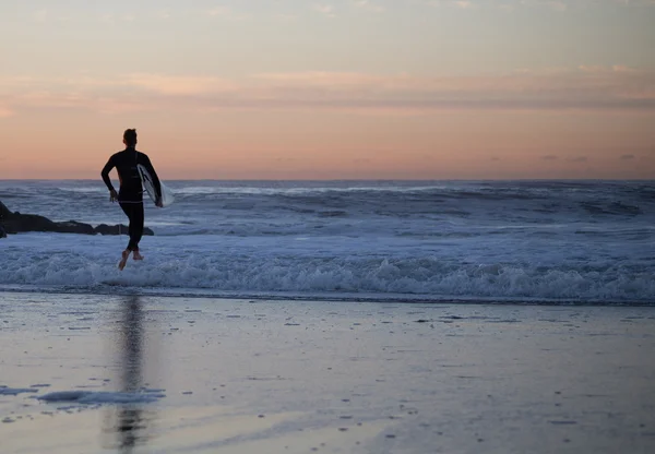 Surfer paddling out