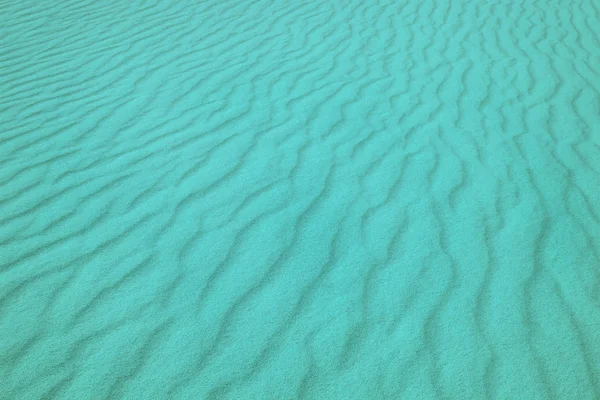 Kum, alışılmadık bir arka plan mükemmel doku mavi dalgalar. — Stok fotoğraf