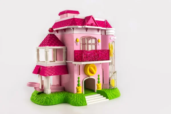 Toy pink two-storey cottage with a balcony and a porch. — Stock Photo, Image