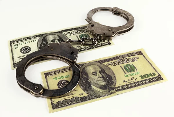 Долари з наручниками ізольовані на білому тлі . — стокове фото