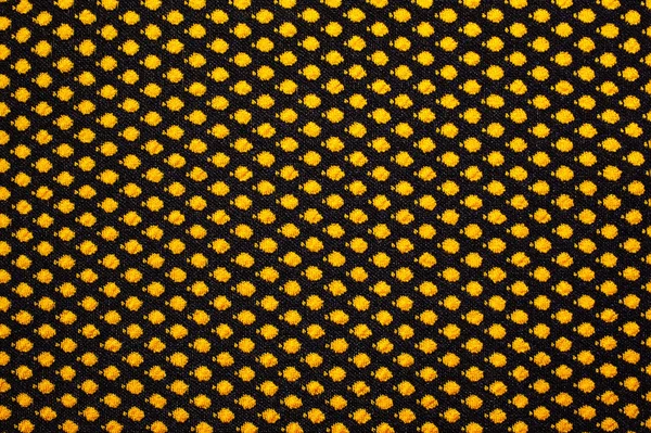 Strickstoff mit gelbem Erbsenhintergrund — Stockfoto