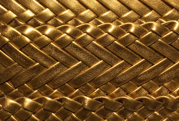 Golden  background with textured leather braided — Stock Photo, Image