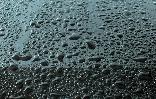 Gotas de lluvia sobre un fondo negro — Foto de Stock