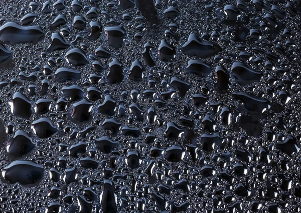 Black glass with natural water drops — Stock Photo, Image