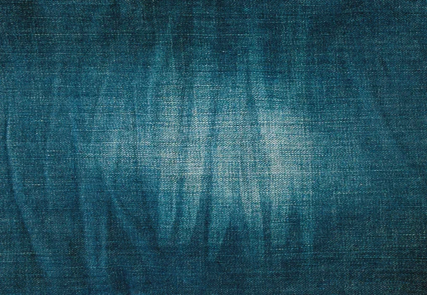 texture of blue jeans with pleats and scuffed