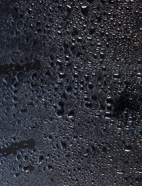 Dark glass with natural water drops — Stock Photo, Image