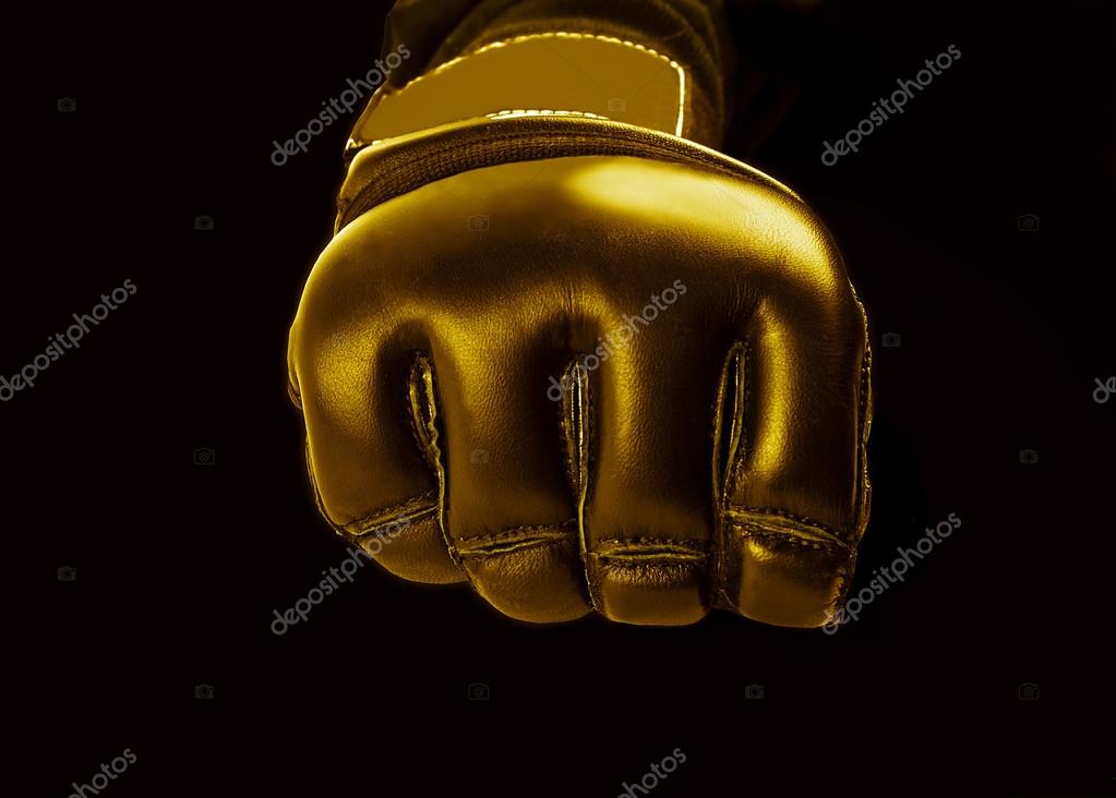 Gold Glove for the martial arts, mma on a  black background