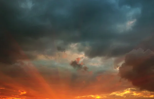 Rays at sunset with storm clouds — Stock Photo, Image
