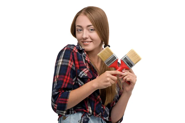 Young girl holding a paint roller — Stock Photo, Image