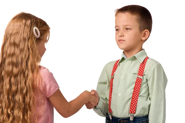 Menino e menina apertando as mãos uns com os outros — Fotografia de Stock