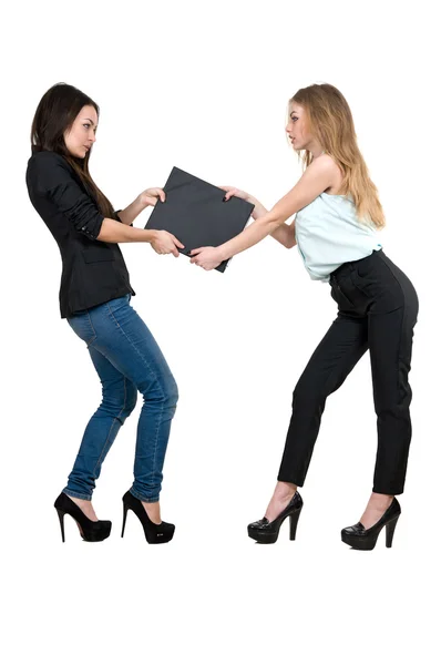 Two women share a folder — Stock Photo, Image