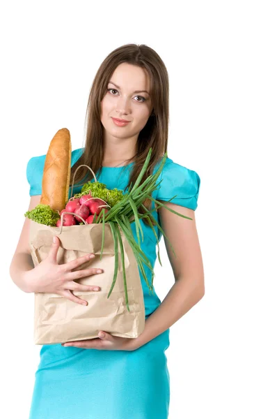 Dívka s balíčkem od obchodu s potravinami — Stock fotografie