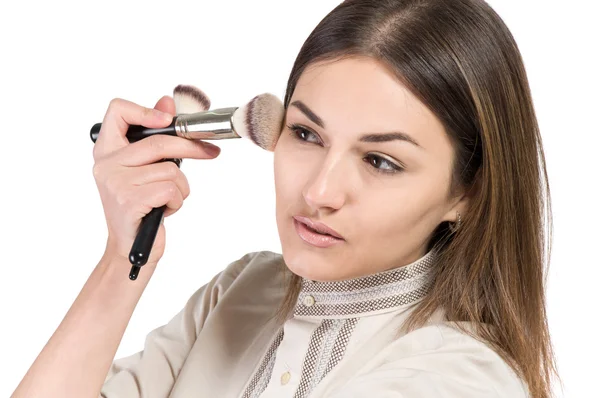 Visagiste. young girl paints her eyes. Girl doing makeup — Stock Photo, Image