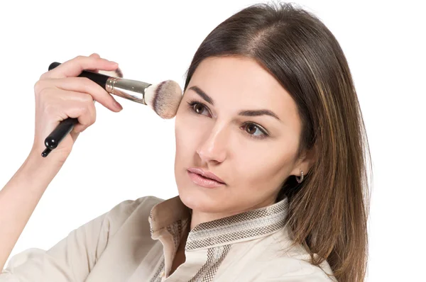 Visagiste. young girl paints her eyes. Girl doing makeup — Stock Photo, Image