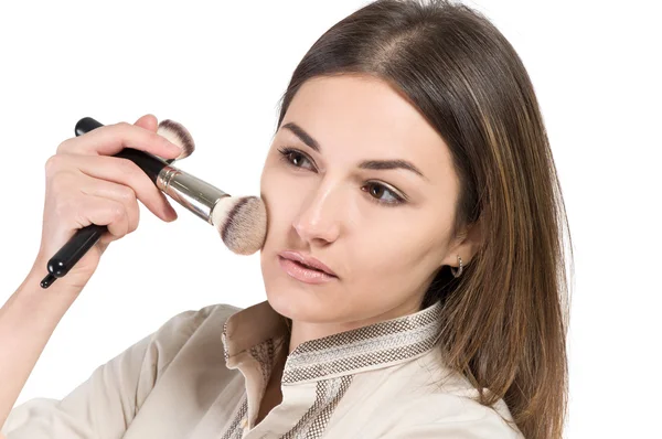 Visagiste. young girl paints her eyes. Girl doing makeup — Stock Photo, Image