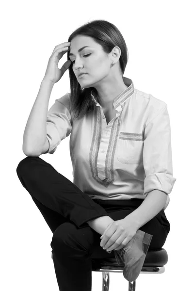 Young business woman sitting in thought. monochrome — Stock Photo, Image