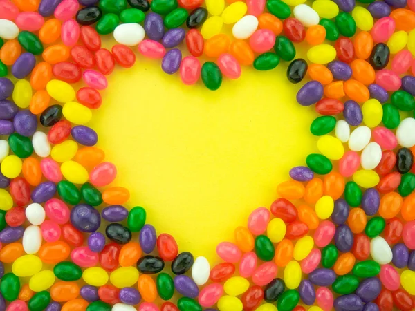 Jelly beans ram och bakgrund (gul bakgrund ) — Stockfoto