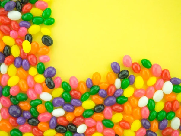 Jelly beans ram och bakgrund (gul bakgrund ) — Stockfoto