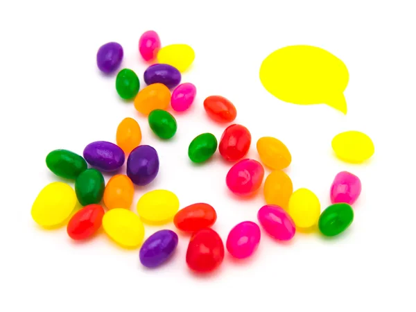 Ballons colorés et haricots gelés (fond blanc ) — Photo