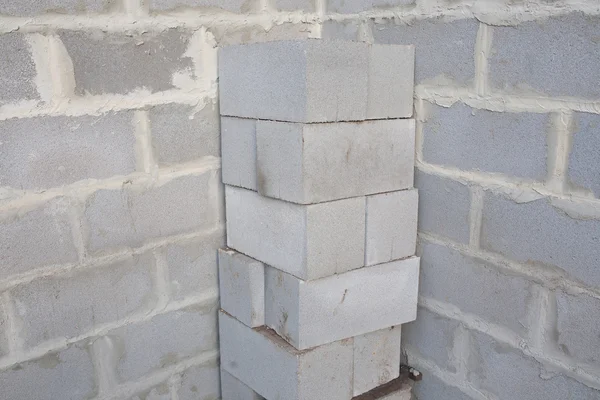 Stack of cement blocks at the construction site. cinder blocks background. — Stock Photo, Image