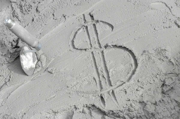 Inscription the dollar on cement with trowel. — Stock Photo, Image