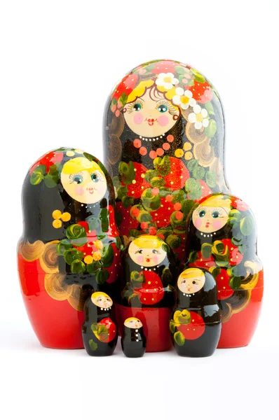 Sieben traditionelle russische Matrjoschka-Puppen auf weißem Hintergrund — Stockfoto