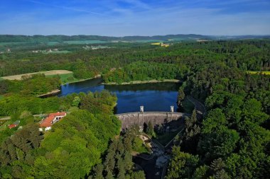 The dam Parizov from plane in the beautiful summer hilly countryside in the Czech Republic - aerial photo from ultralight plane