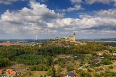 Aerial photo of beautiful medieval castle Kunticka hora near city of Pardubice in the heart of Czech Republic on the top of the hill in surrouding lowlands and villages nearby from ultralight plane