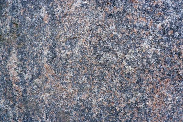 Granite texture. Close-up of gray granite surface. Stone background.