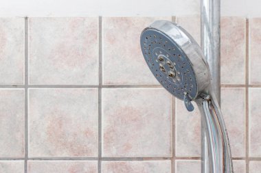 Shower faucet in a close-up, plaque from water in on the tap