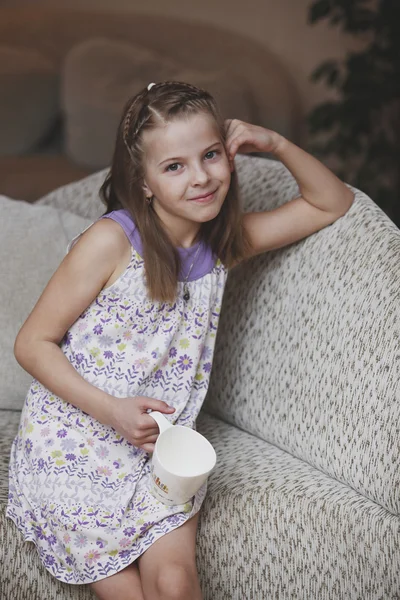 The girl child with a mug