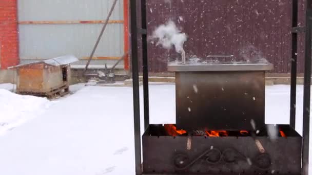 Metal smoker box standing on fire — Stock Video