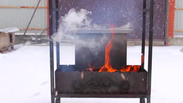 Metal smoker box standing on fire — Stock Video