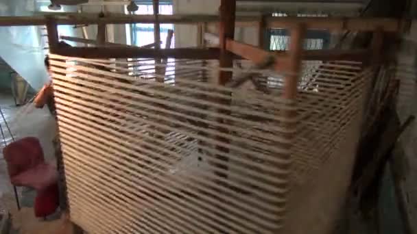 Man organizing freshly produced silk — Stock Video