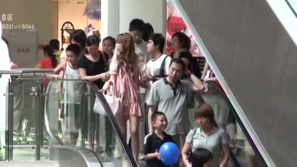 People on escalators in a Guangzhou — Stock Video