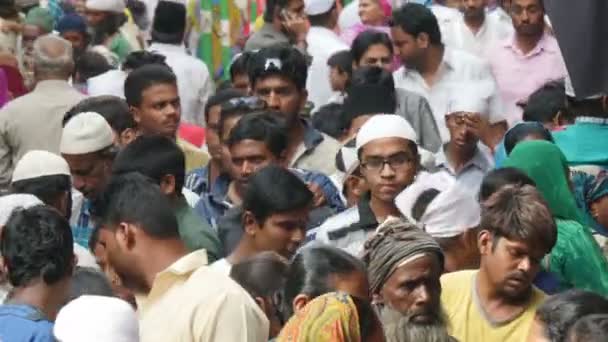 Crowds walk through a busy street — Stock Video