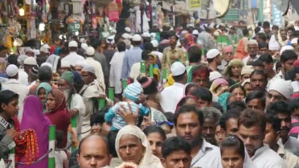 Crowds walk through a busy street — Stock Video