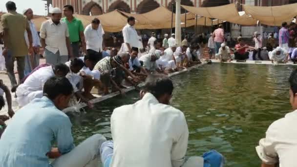 Muslim men wash faces beore attending mosque — Stock Video