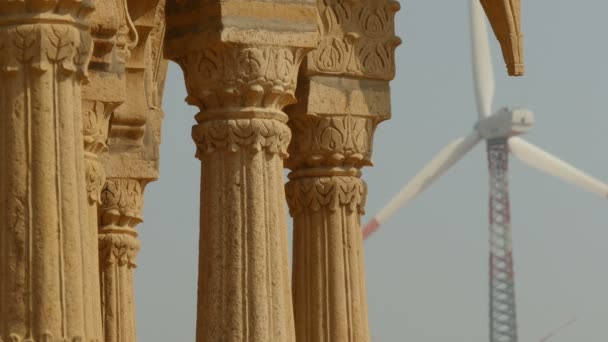 Wind farms behind an ancient monument — Stock Video