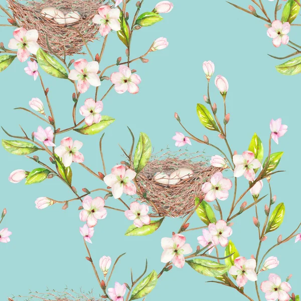 Seamless pattern of the watercolor bird nests on the branches with spring flowers, hand drawn on a blue background — Stock Image Seamless pattern of the watercolor bird nests on the branches with spring flowers, hand drawn on a blue background Stock Picture