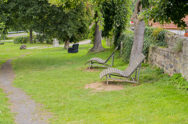 Two loungers to relax in the park.