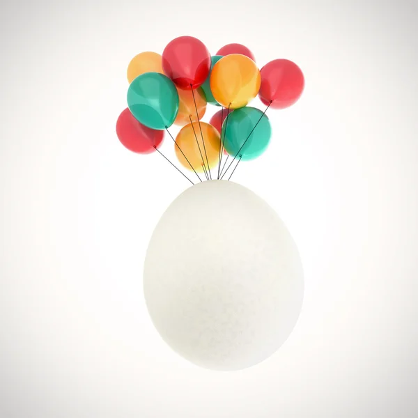 Easter egg flying on balloons — Stock Photo, Image