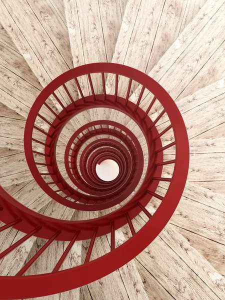 Спиральная лестница с красной балюстрадой — стоковое фото