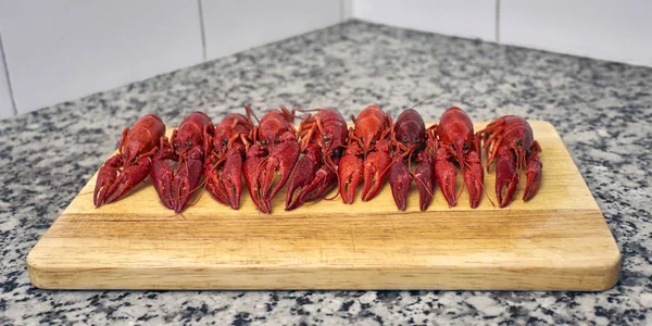 Red river crayfish on cutting board — Stock Photo, Image