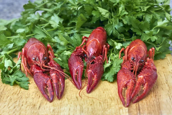 Red river crayfish with parsley on cutting board — Stock Photo, Image