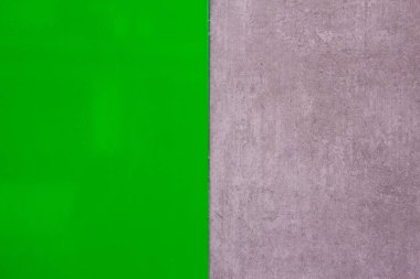 Gri duvar dokusuyla cilalanmış yeşil doku. Mesaj için yer var. Geçmişi. Modern tasarım.