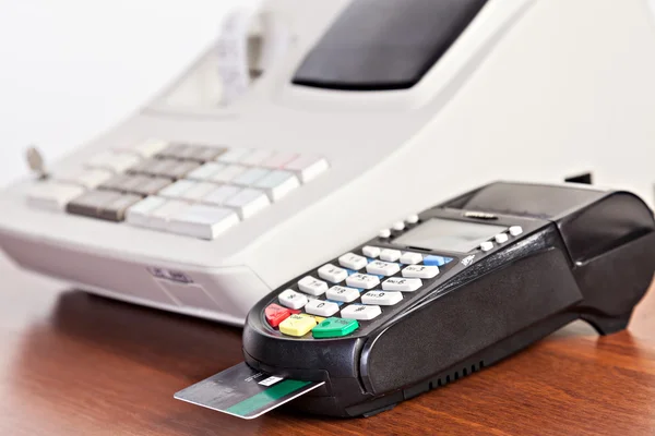 Close-up of cards servicing with POS-terminal on the cash regist — Stock Photo, Image